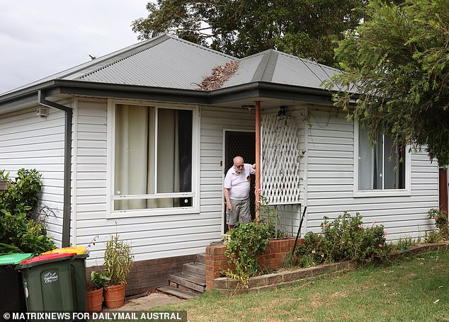 The grieving father says he complained for years about his neighbor's gum tree before his son allegedly died in a dispute over fallen branches. John Franks appears at the Mount Pritchard house in Sydney's western suburbs, where he lived with his son Michael Wickham.