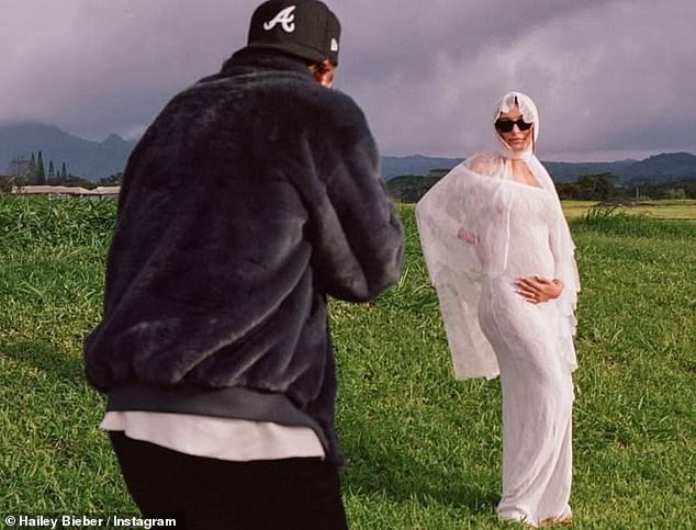 The image they chose to share the news showed Michelle in a loose white suit that draws comparisons to the photo that Justin and Hailey Bieber published to announce that they were expecting their first child in May.