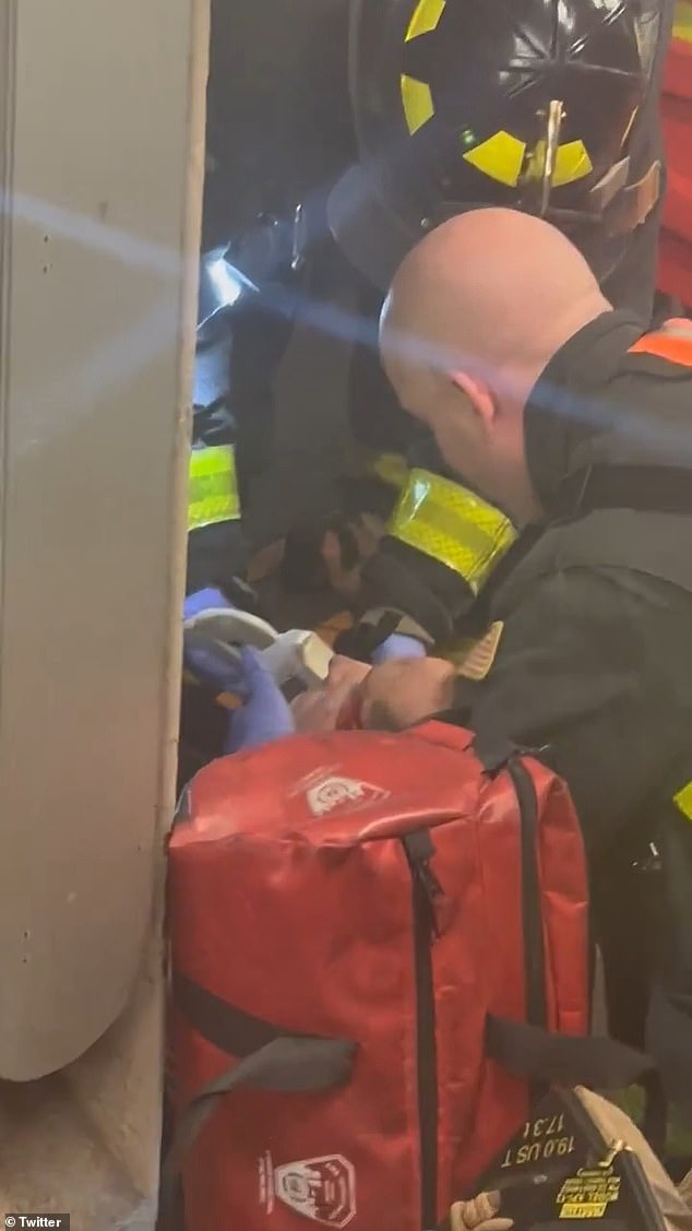 Video shared by stunned passengers showed a dozen firefighters working to remove the man, who appeared to have blood on his face, from the Manhattan subway