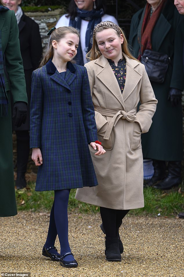 Princess Charlotte walks alongside Mia Tindall as they attend a Christmas church service with the rest of the royal family on Christmas Day.