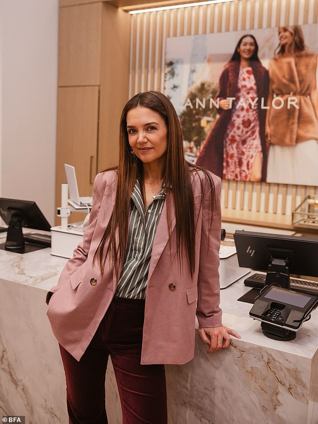 Actress (and former face of the brand) Katie Holmes was among the more than 75 attendees at this private event. She was dressed in Ann Taylor velvet Jayne slacks, a loose-fitting mauve double-breasted jacket, and a striped tunic shirt with pockets.