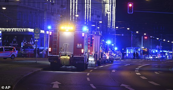 Emergency services attend an incident at the Christmas market in Magdeburg, Germany, Friday, December 20, 2024. (Heiko Rebsch/dpa via AP)