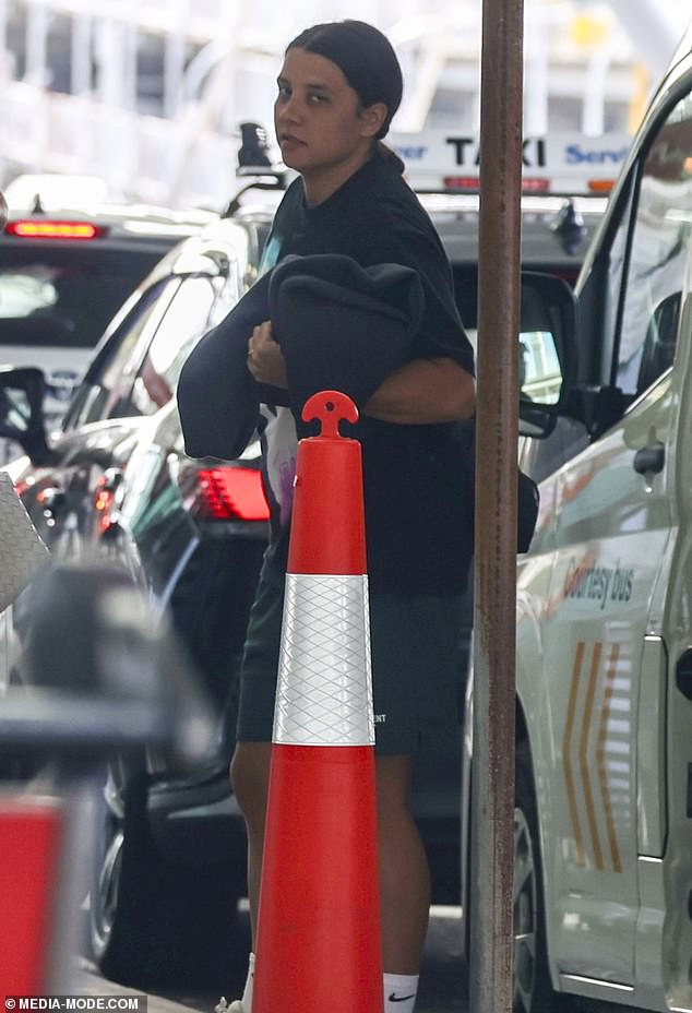 A somber-looking Sam Kerr at Sydney Airport on Saturday following the news about her grandmother.