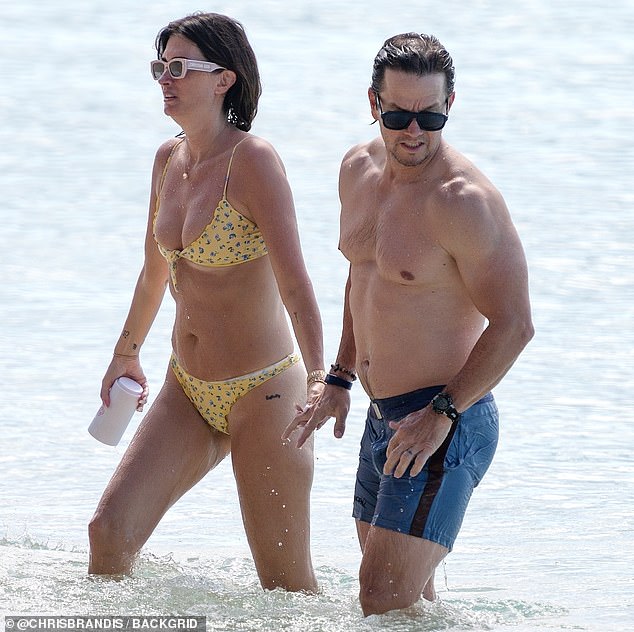 On Sunday, the Fear actor, 53, and his wife, 46, were seen holding hands as they walked out of the ocean together.