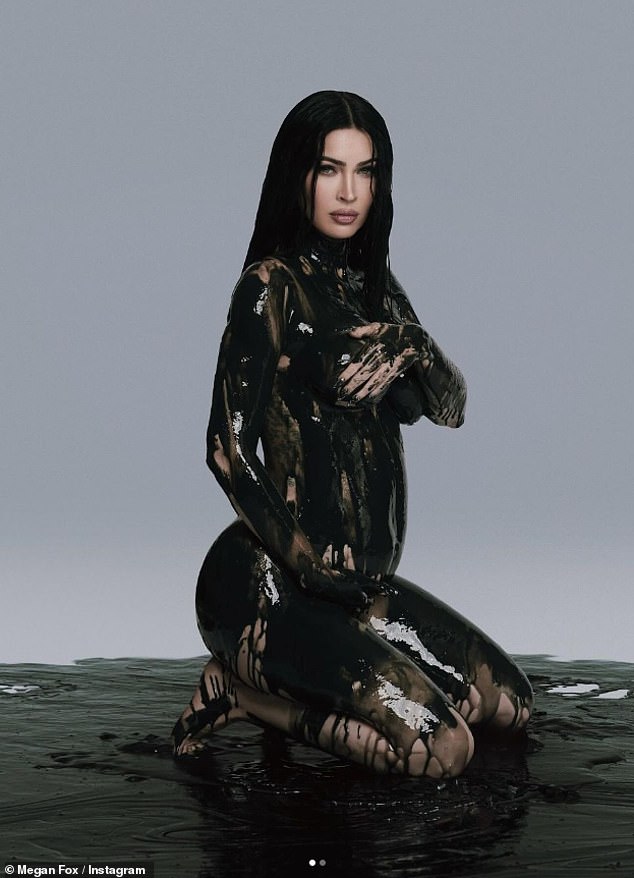 Megan revealed her pregnancy on November 11, sharing a sexy photo of herself covered in black paint and showing off her baby bump.