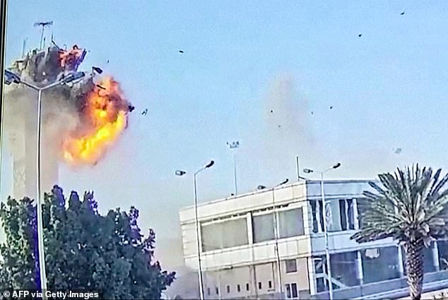 The video then cuts to show the moment the Israeli strike hits the control tower, sending debris and smoke into the air.