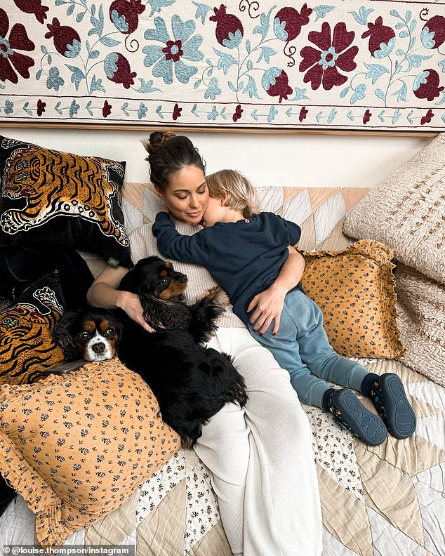 Sweet relief: Louise returns home to her son Leo and dogs Toto and Koji