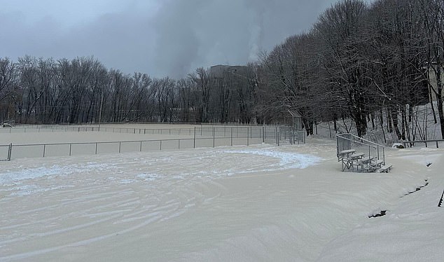 A layer of brown-colored snow is in stark contrast to the continuous white snow that lies under the 'fresh' coat of Tuesday morning