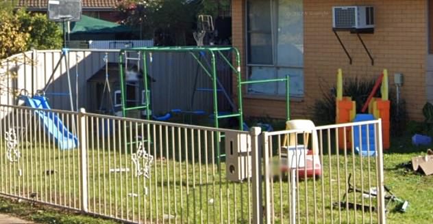 The front yard of the house was still full of children's games.