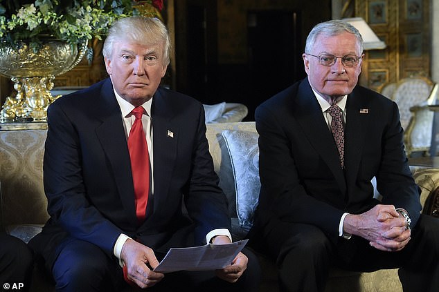 President Donald Trump, center, sits with retired Army Lt. Gen. Keith Kellogg, right.