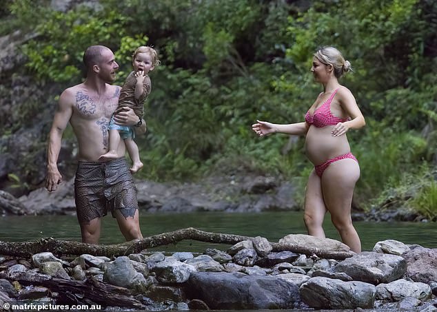 The generically blessed family made the most of their serene surroundings by enjoying a paddle on the water.