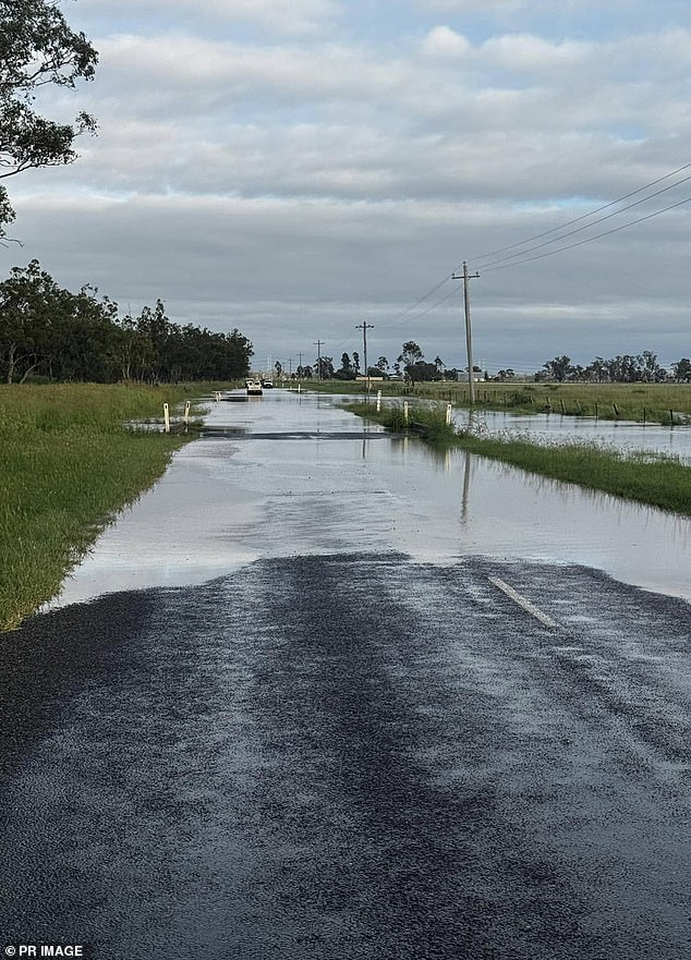 It follows a week of rain across the Sunshine State causing flash flooding that covered roads (pictured, flooding on the Western Downs)