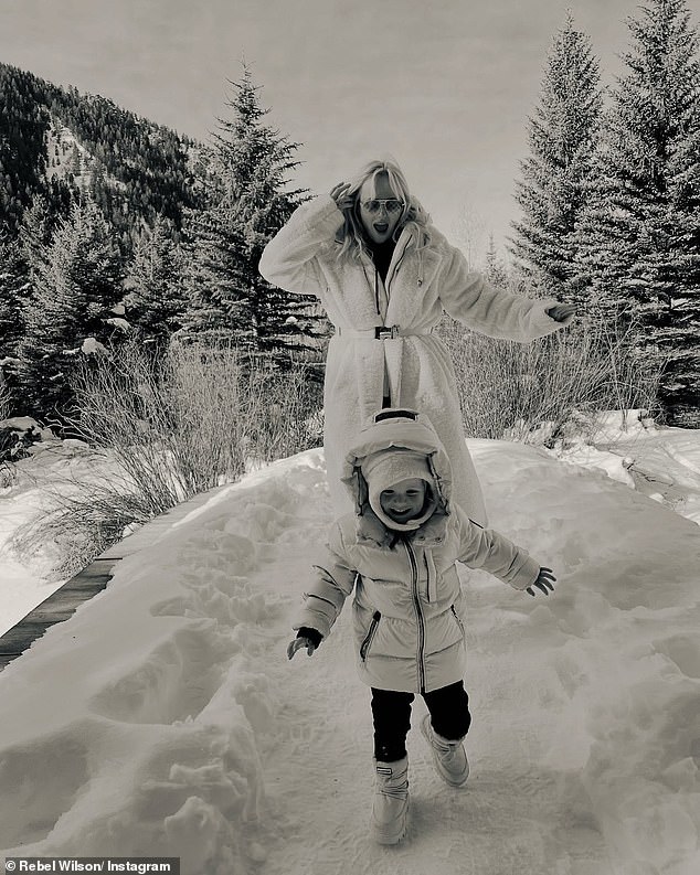 One photo in a series shared on Instagram this week showed Rebel, dressed in an oversized white ski jacket, playfully chasing Royce through a winter scene.