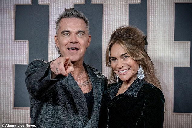 Robbie with his American wife of 14 years, Ayda Field, mother of his four children, aged 11 to four.