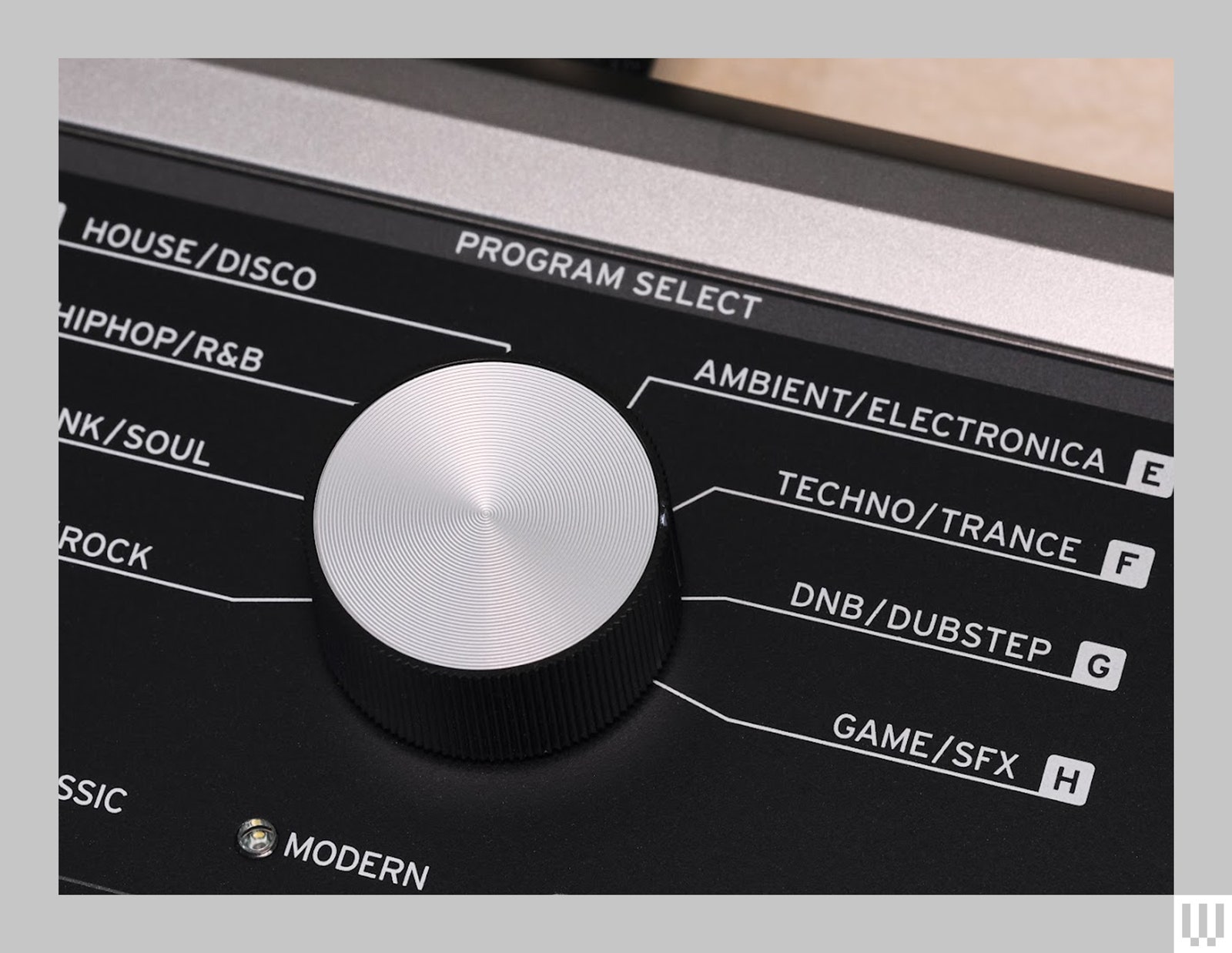 Close-up of the Roland Micro Korg 2, a musical keyboard synthesizer that shows off the different musical genres to choose from, such as...