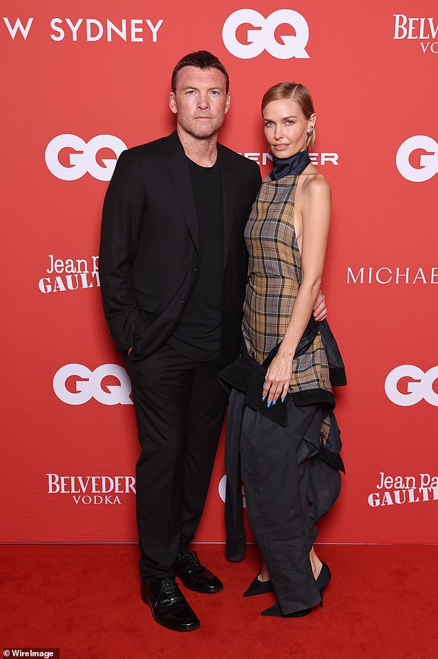 Sam Worthington attends the 2024 GQ Men of the Year Awards with his wife Lara. Both in the photo