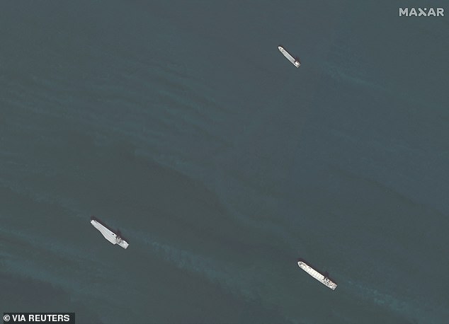 The aircraft carrier (bottom left) was depicted in formation with two Iranian naval vessels: Shahid Roudaki (top right) and Shahid Mahdavi (bottom right)