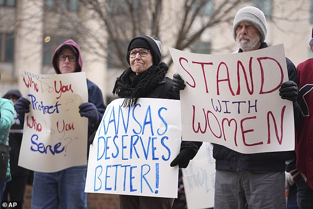 About 50 people held a brief rally in subzero temperatures outside the federal courthouse in Topeka to show their support for the women who accused Golubski