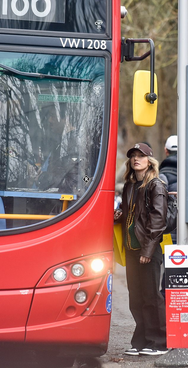 Boarding a bus in the capital, he wore a stylish brown leather jacket with baggy jeans.