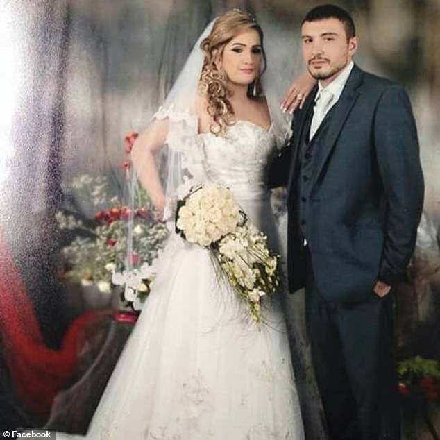 Standing arm in arm and with Mrs Hawatt carrying a bouquet of white roses, the couple poses for the camera in their wedding finery (pictured)