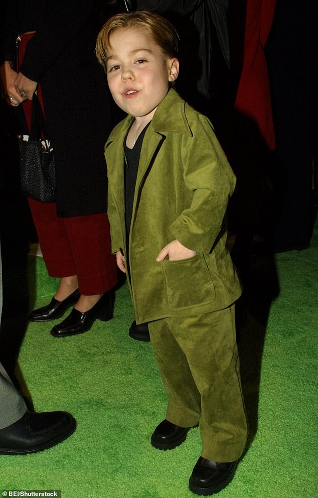 Due to his achondroplasia, Evans often played children's roles despite being an adult (pictured at the Grinch premiere in 2000).