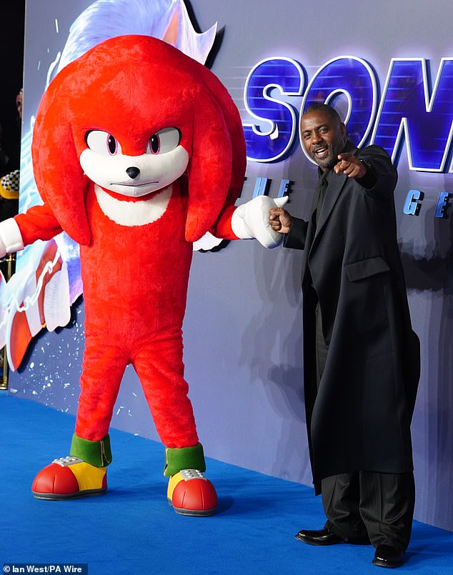 English actor and rapper Idris joked around with a Sonic mascot while posing for photos.