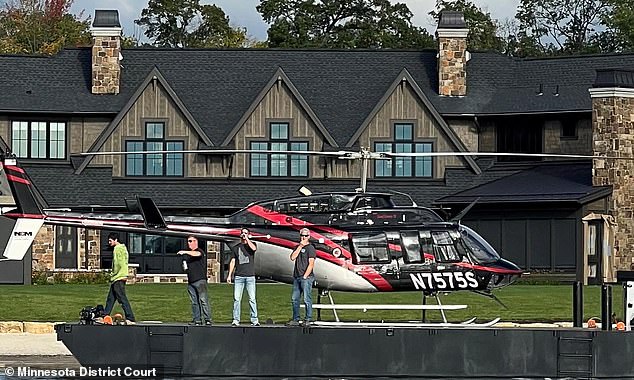 A construction magnate's use of a helicopter at his Minnesota vacation home has led to a lawsuit and numerous complaints from neighbors. The photo shows photos of the helicopter being used as evidence ahead of a looming trial in January