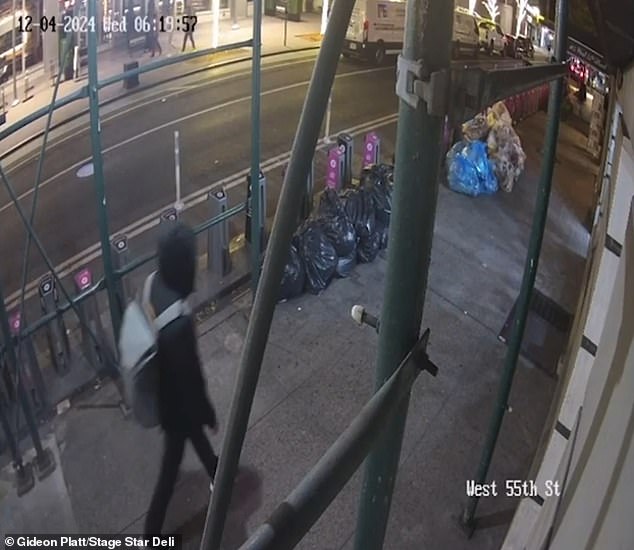 A new image obtained by CNN shows the killer walking along West 55th Street as he made his way to the Hilton Hotel on the morning of the shooting