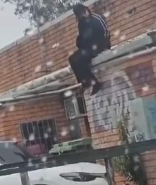 Chiem's ​​lawyer has confirmed his client was the black-clad figure filmed on the roof of the takeaway shop on Saturday morning.