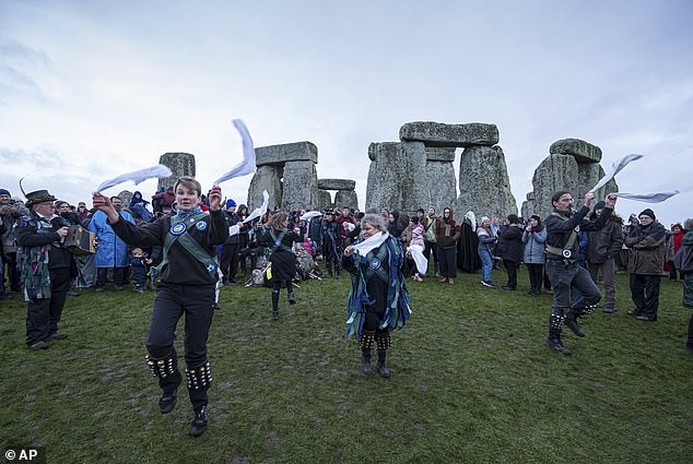 Morris dancers participate in winter solstice celebrations.