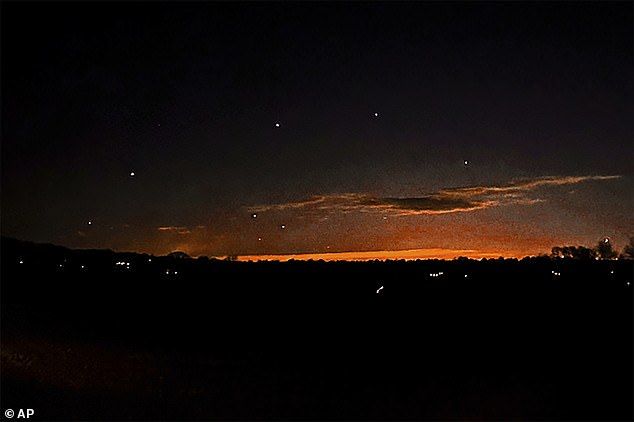 Flying objects, like these seen in the night sky near Lebanon Township, New Jersey, are larger than drones used by hobbyists, witnesses have observed, raising questions about their proximity to critical infrastructure and sites. sensitive.