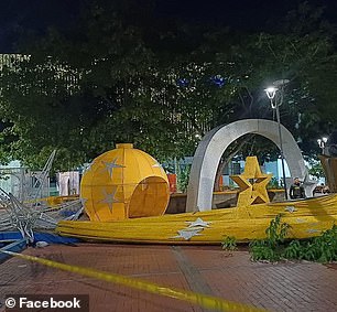 The metal Christmas tree fell over during the city's holiday festival