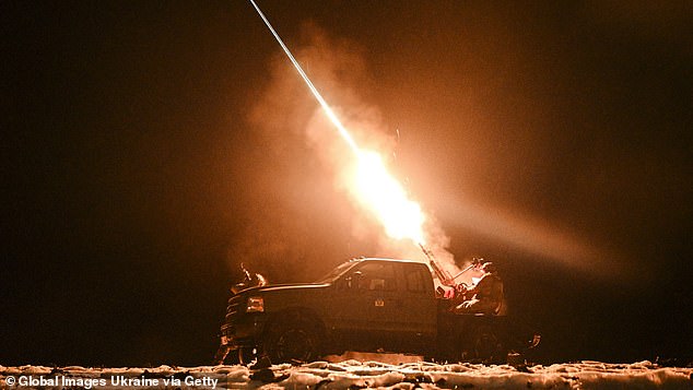 Ukrainian servicemen of the mobile air defense unit fire a machine gun at Russian drones during a night patrol on December 2, 2024 in Chernihiv Oblast.