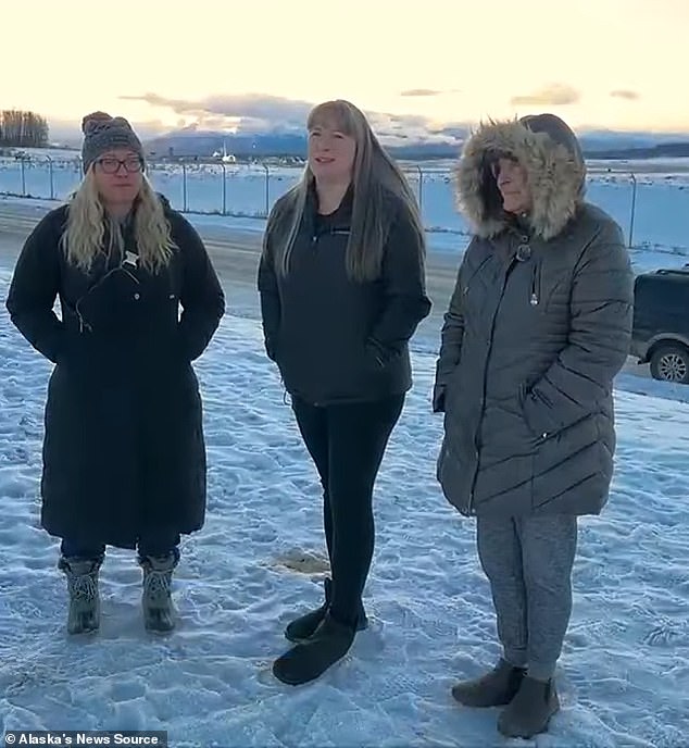 Passenger Michelle Tatela (center) told how they only learned the plane hit an Eagle after the plane landed safely at the airport