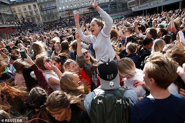 Avicii fans gather to honor the Swedish DJ in central Stockholm on April 21, 2018.