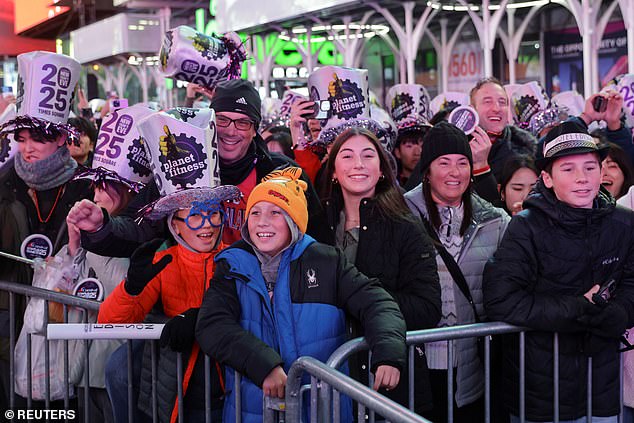 People from all over the world traveled to party together at the iconic street venue, waiting patiently in the drizzle as they prepared for a long night of entertainment