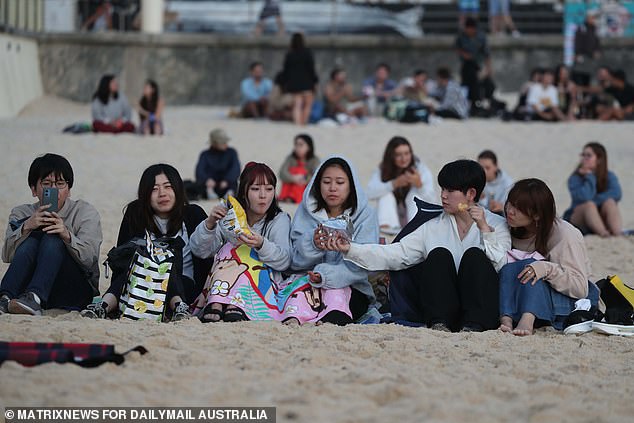 Many spent hours camped on Bondi Beach before dawn.