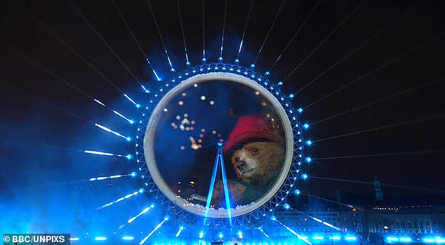 A massive fireworks display lit up Big Ben despite storm warnings that forced many shows to be canceled today, and many fans were stunned by a cameo from Paddington Bear, 