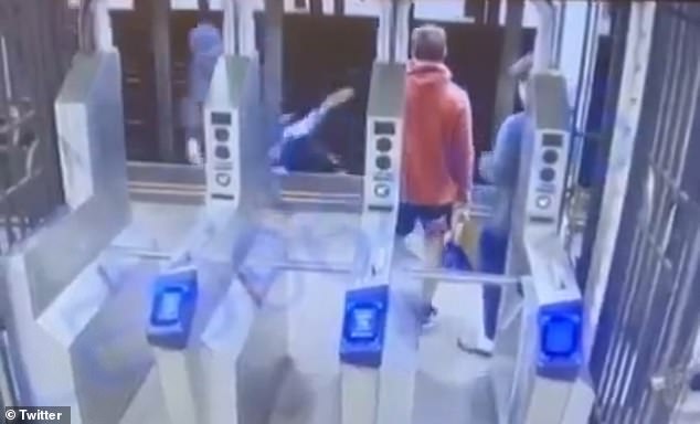 Shocking footage of the moment a man was pushed under a New York City subway train by a masked assailant who fled the scene