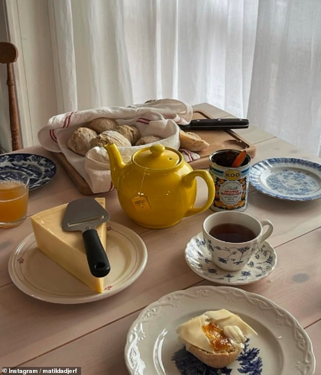 The carefully curated 'photo dump' also shows a breakfast table, Matilda dipping her green Hunter wellies into the sea and the influencer wrapped up in pink checked pajamas.