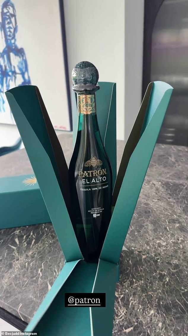 The AFL WAG took to her Instagram Stories to show off the gift which included a $350 bottle of spirits and two luxury drinking flutes.