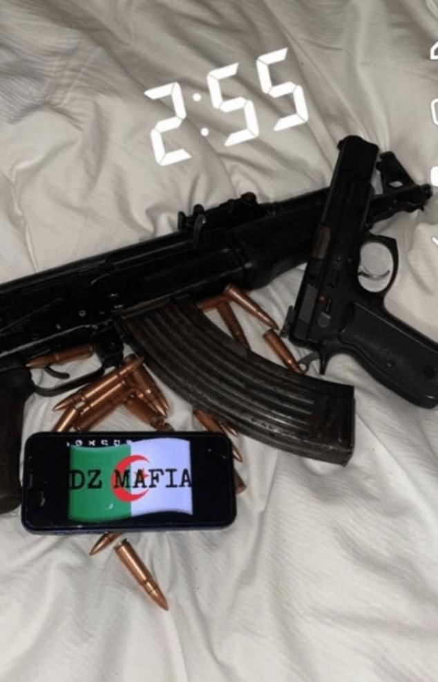 A cache of weapons and ammunition appears in a Snapchat post next to the DZ Mafia tag and an Algerian flag