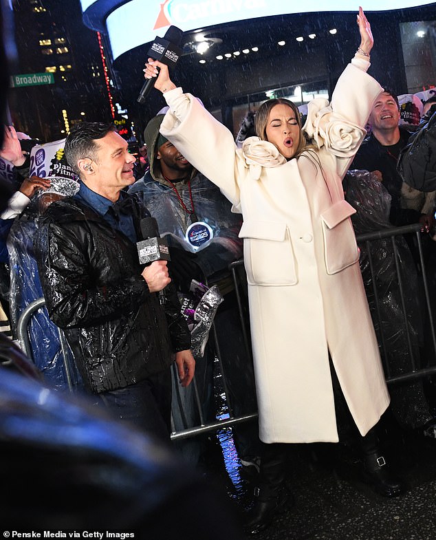 Ora was also seen raising her arms in the air as rain poured down during the celebration.