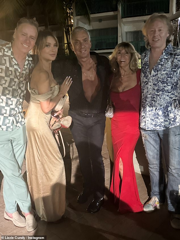 The TV personality was also joined by his friend Bruno Tonioli, 69 (centre), who looked dapper in a black shirt, which he left unbuttoned to show off his toned physique.