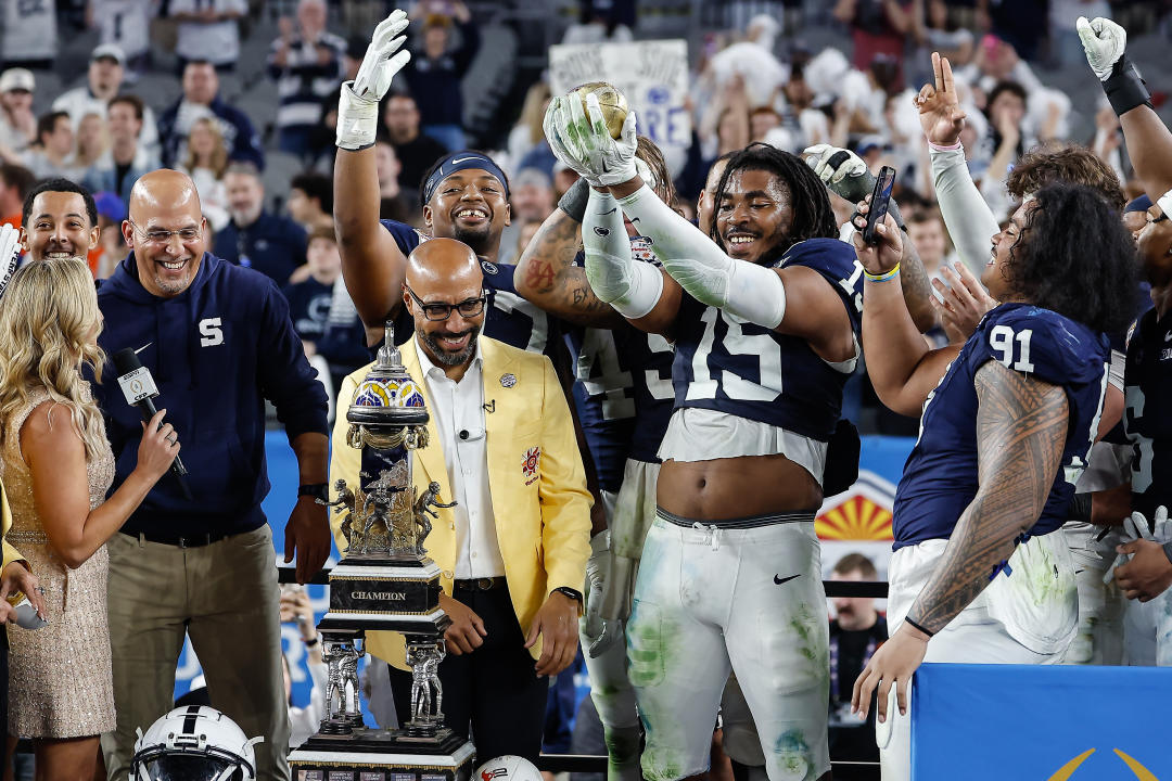 GLENDALE, AZ - DECEMBER 31: Defensive end Amin Vanover #15 of the Penn State Nittany Lions holds up the Fiesta Bowl trophy after the Penn State Nittany Lions versus Boise State Broncos College Football Playoff quarterfinals at the Vrbo Fiesta Bowl on December 31, 2024, at State Farm Stadium in Glendale, AZ. (Photo by Kevin Abele/Icon Sportswire via Getty Images)