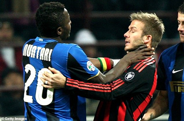 Sulley Muntari approaches David Beckham in a Milan derby in 2009.