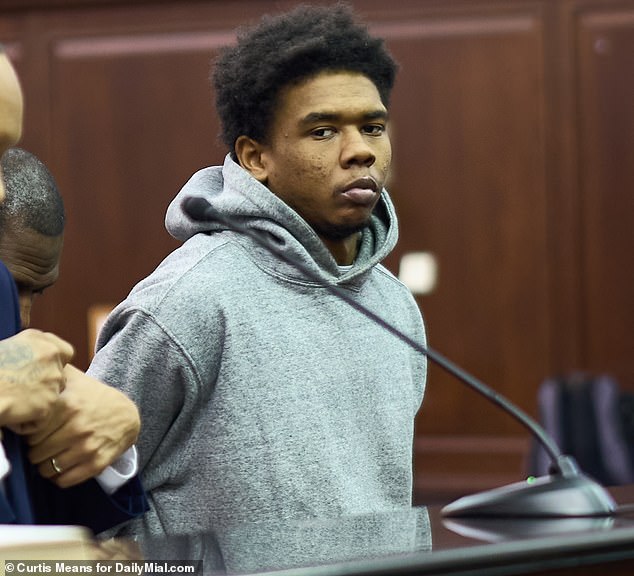 His accused attacker, 23-year-old Kamel Hawkins, looked on indifferently as he was arraigned on New Year's Day for attempted murder and second-degree assault in Manhattan Criminal Court.