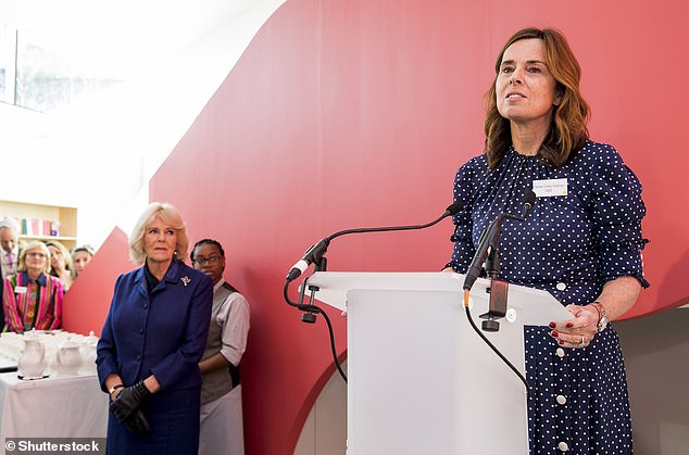 Queen Camilla looks on as Dame Cally Palmer gives a speech during a visit to Maggies at The Royal Marsden on February 6, 2020.