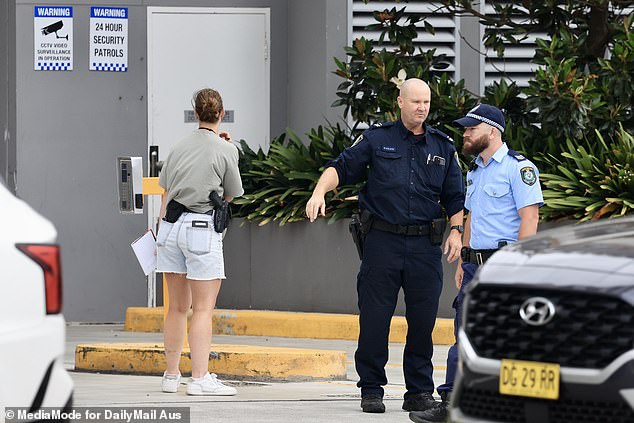 Police were seen stopping and questioning residents as they left the underground parking lot.