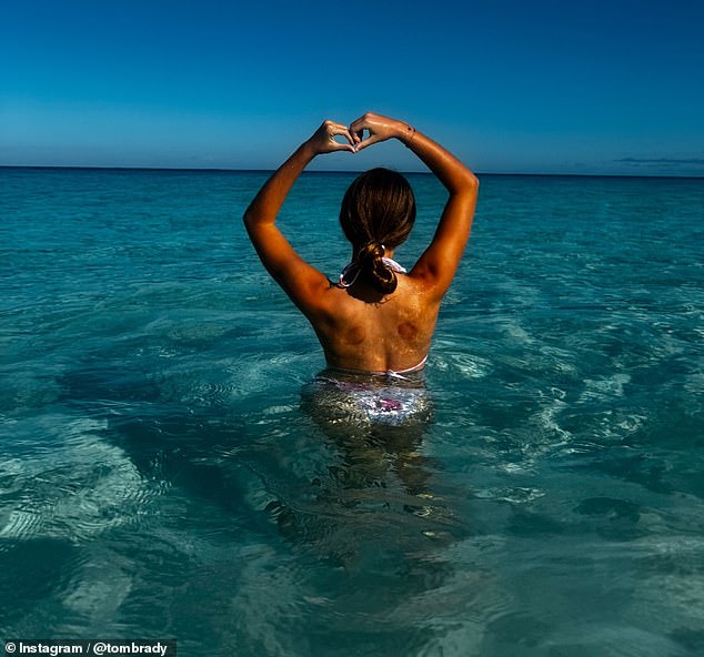 The collage of images also included her daughter Vivian making a heart shape with her arms while standing in the water at a tropical destination.